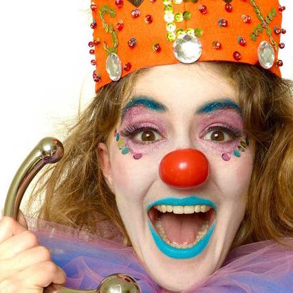 clown holding a sex toy