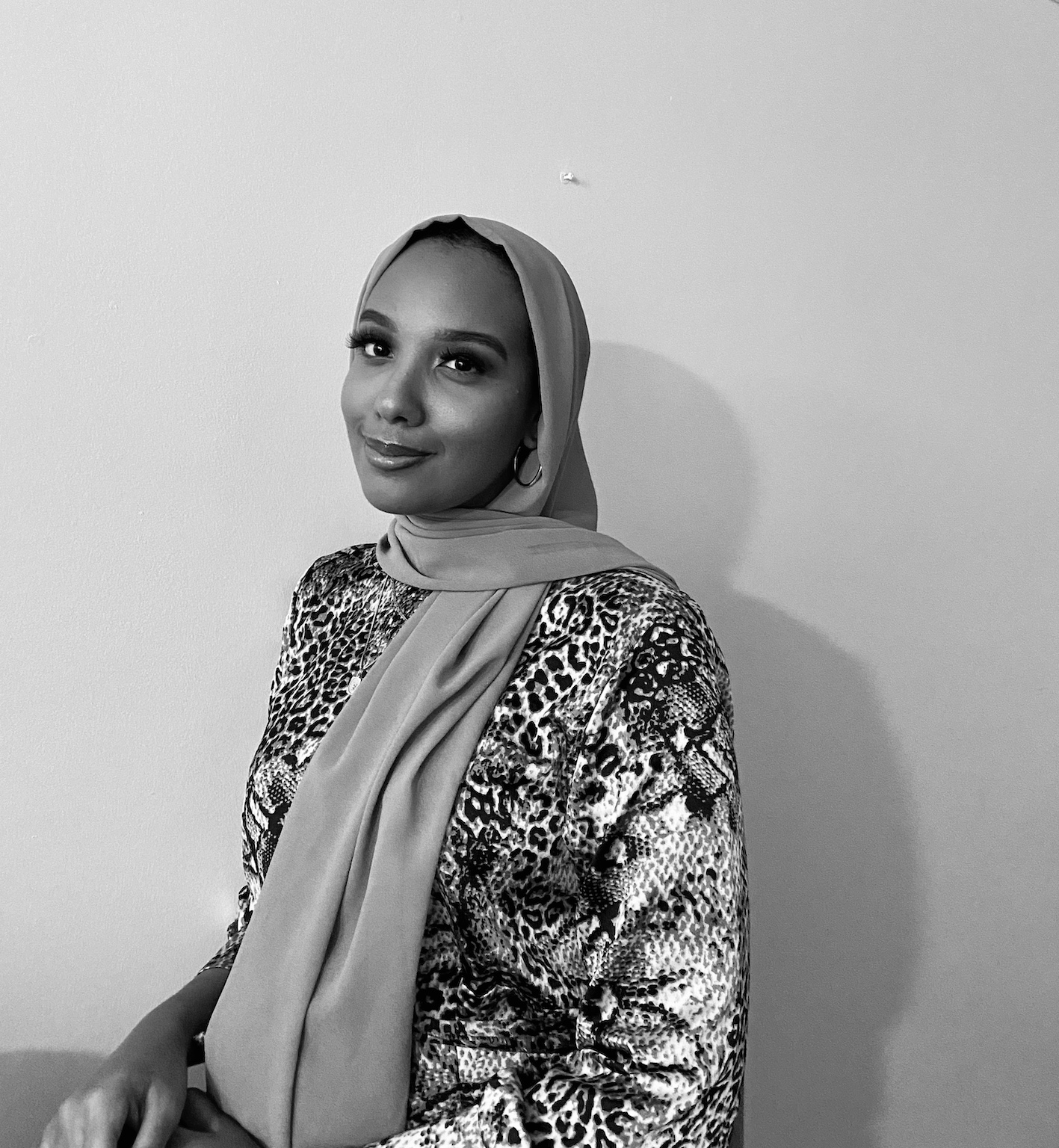 Furqan Mohamed__author photo Black and white author photo of Furqan Mohamed