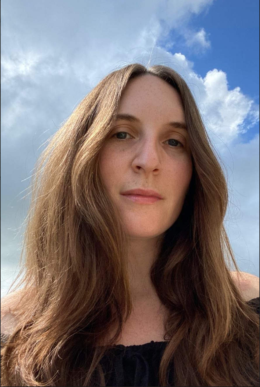 Author photo of Meghan Gagliardi. In the backdrop are clouds and a corner of blue sky.